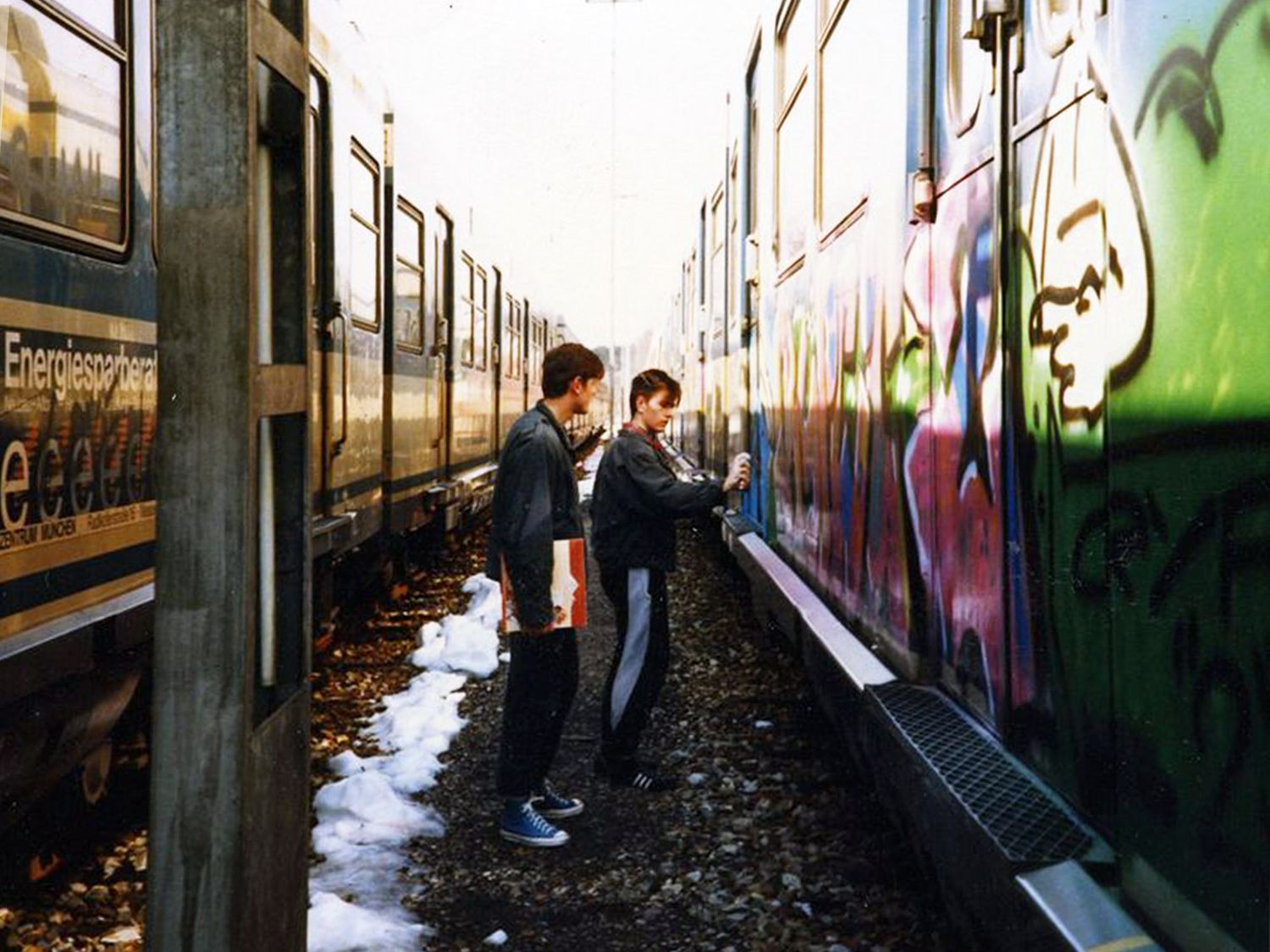Back in 1985 with this historical picture of Blash (left) and Loomit spraying a train at the Geltendorf yard during the golden years of illegal graffiti in Berlin (©Cheech H/ From Here To Fame Publishing).