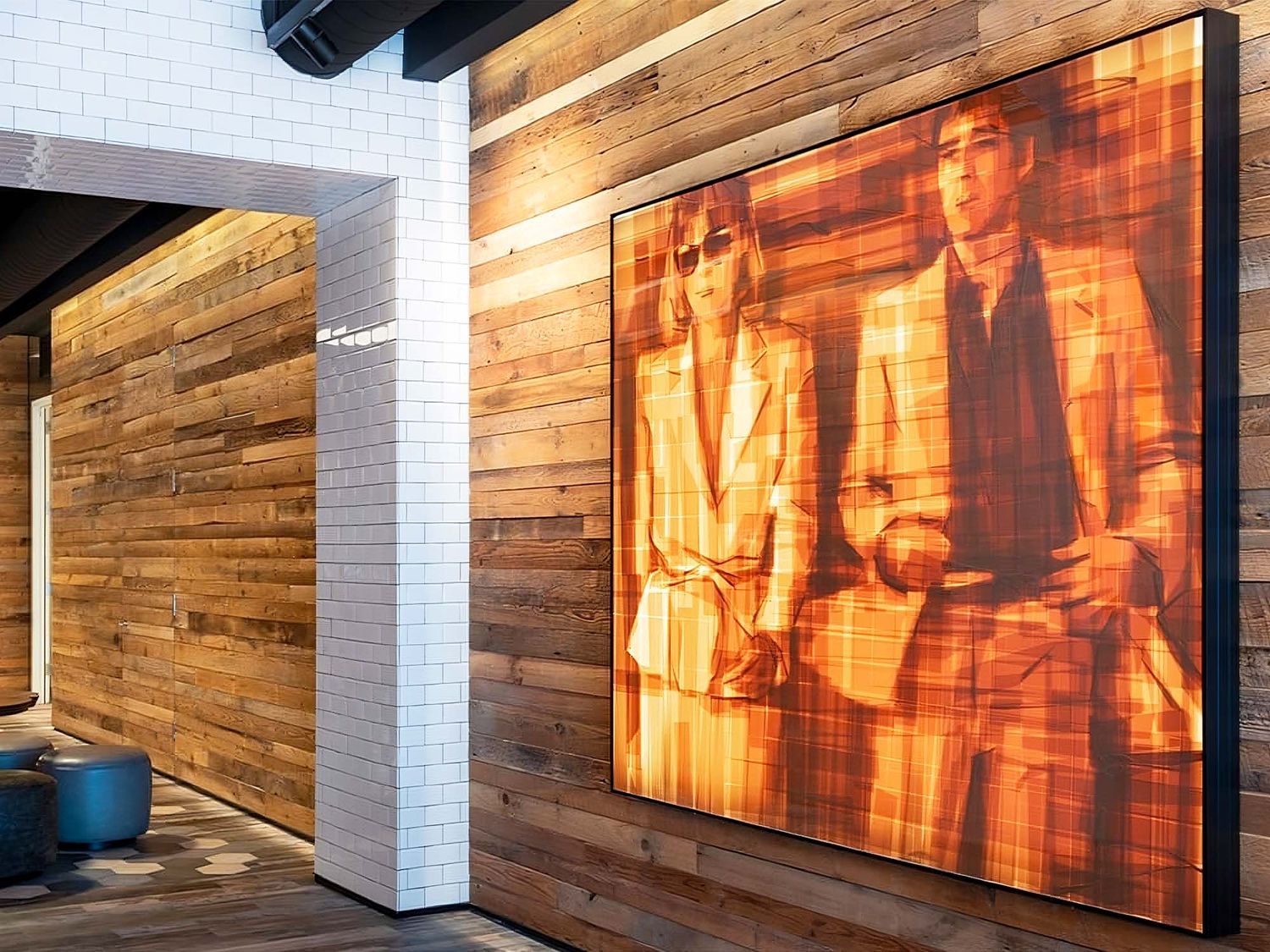 Pioneer of brown tape art, Mark Khaisman use a unique technique to create striking portraits such as this artwork inspired by the film Scarface and displayed in the Comcast office (©Comcast).